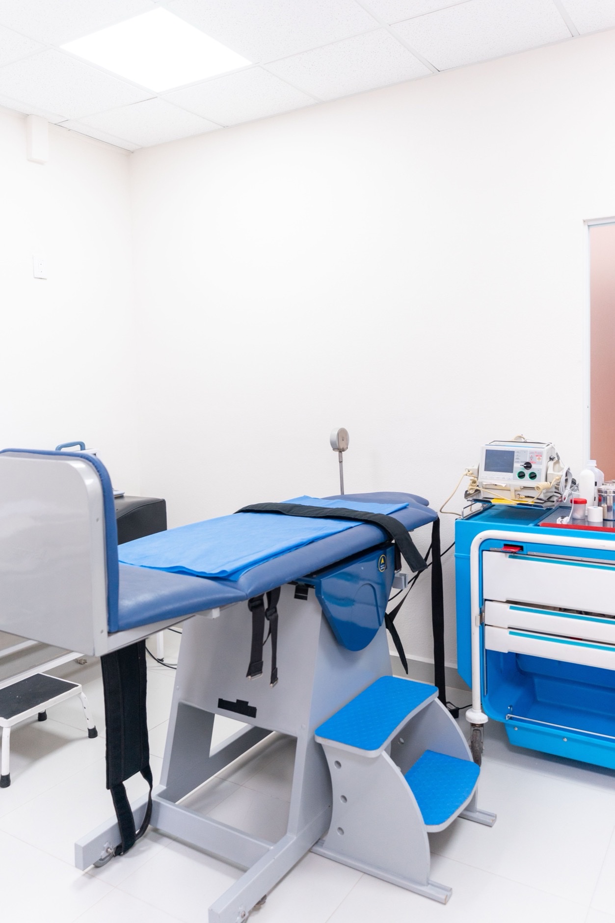 Chiropractic treatment table and equipment in a clean exam room