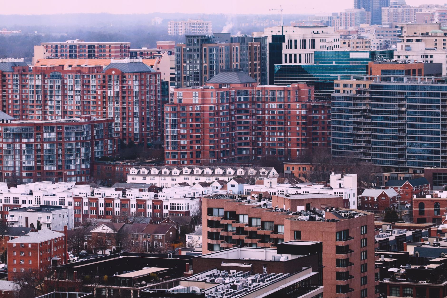 Aerial view of a multifamily apartment complex with red-brick residential buildings