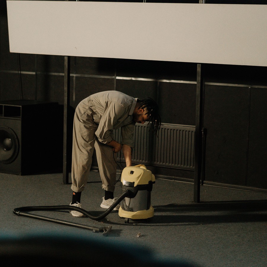 Cleaning technician vacuuming a commercial floor